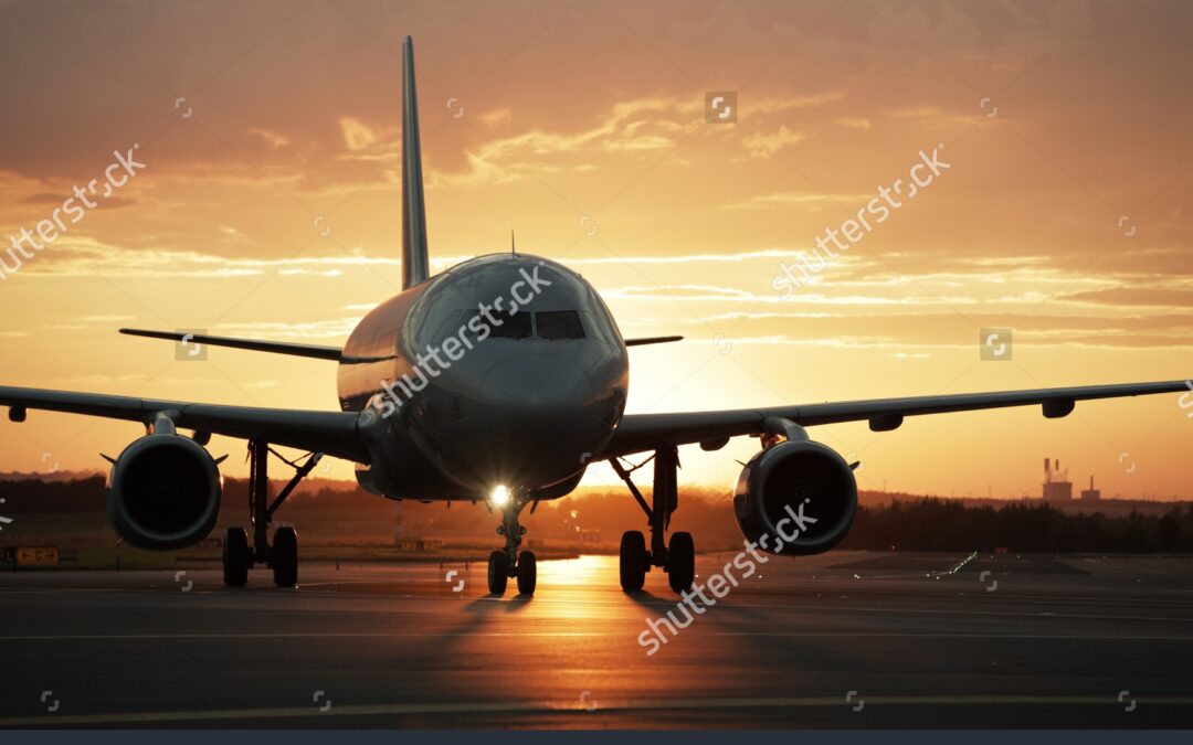 stock-photo-airplane-at-sunset-back-lit-109696760